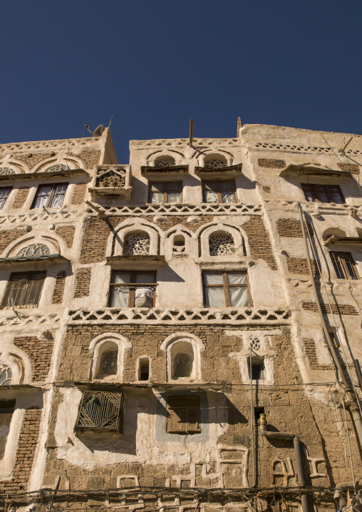 Traditional house in the old city featuring stained-glass windows, Amanat Al-Asemah, Sanaa, Yemen