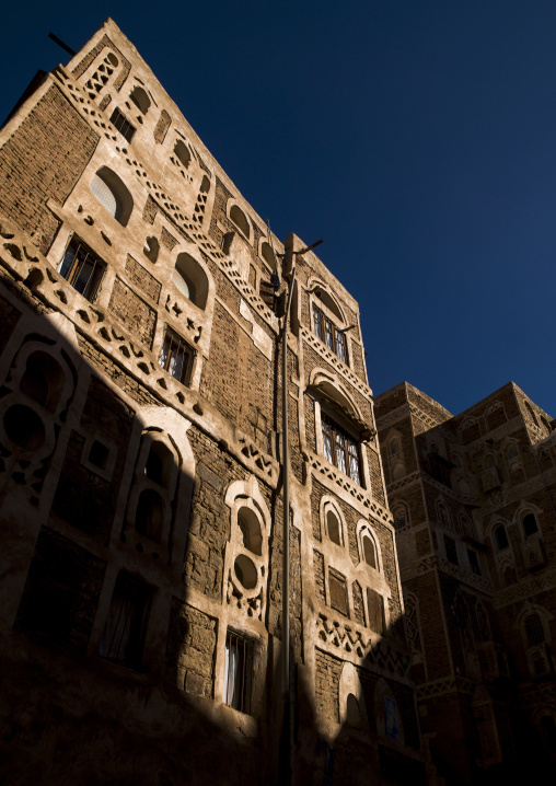 Traditional houses in the old city featuring ornamental facades, Amanat Al-Asemah, Sanaa, Yemen