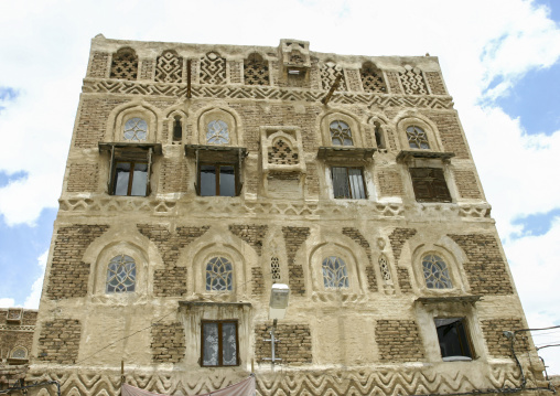 Traditional house in the old city featuring stained-glass windows, Amanat Al-Asemah, Sanaa, Yemen