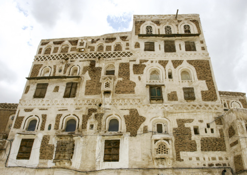 Traditional house in the old city featuring stained-glass windows, Amanat Al-Asemah, Sanaa, Yemen