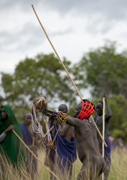 Suri tribe warriors fighting during a donga stick ritual, Omo valley, Tulgit, Ethiopia