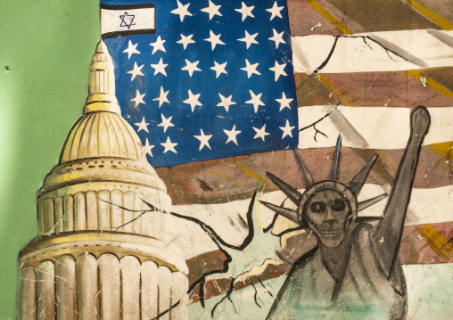 Anti-american mural propoganda slogan depict statue liberty skeleton on the wall of the former united states embassy, Shemiranat county, Tehran, Iran