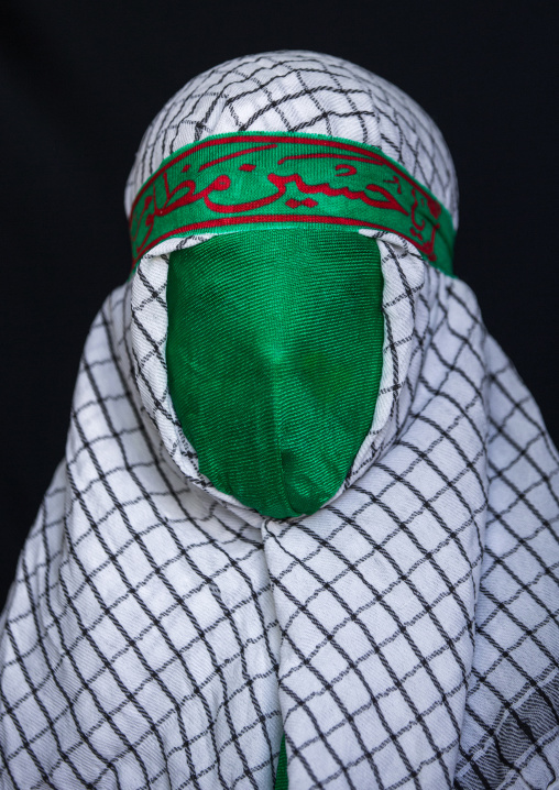 Iranian Young Man With Green Veil Covering His Face During Chehel Menbari Festival On Tasua To Commemorate The Martyrdom Of Hussein, Lorestan Province, Khorramabad, Iran