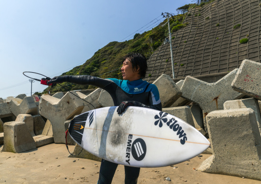 Japanese surfer in the contaminated area after the daiichi nuclear power plant irradiation, Fukushima prefecture, Tairatoyoma beach, Japan