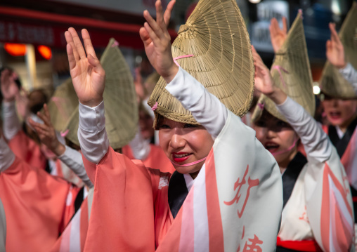 Japanese women with straw hats during the Koenji Awaodori dance summer street festival, Kanto region, Tokyo, Japan