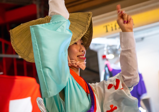 Japanese woman with straw hat during the Koenji Awaodori dance summer street festival, Kanto region, Tokyo, Japan