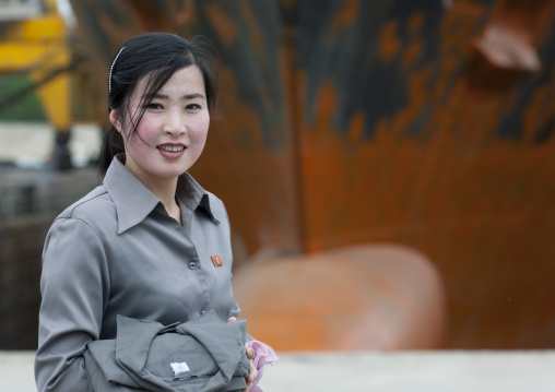 Smiling North Korean woman in a harbour, South Pyongan Province, Nampo, North Korea