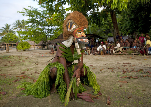 Malagan tatuana masks dance during a funeral ceremony, New Ireland Province, Langania, Papua New Guinea